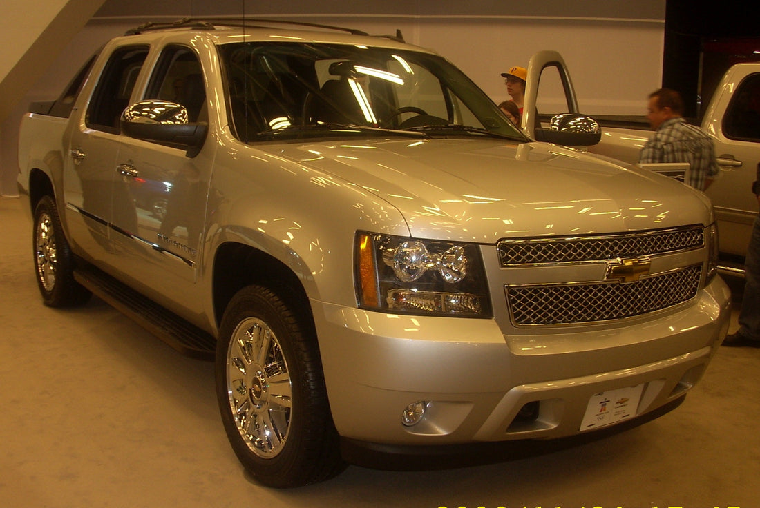 Silver 2010 Chevrolet Avalanche crew-cab pickup, front three-quarter auto-show view