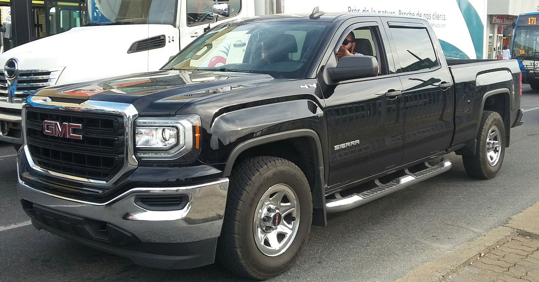 Black 2016 GMC Sierra 1500 crew-cab pickup, front three-quarter view
