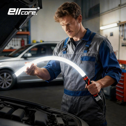 Mechanic in a workshop bending the glowing light into an arch over an open car hood