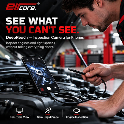 A mechanic in a workshop leaning over an open bonnet with the phone propped on the engine showing the live view from the probe