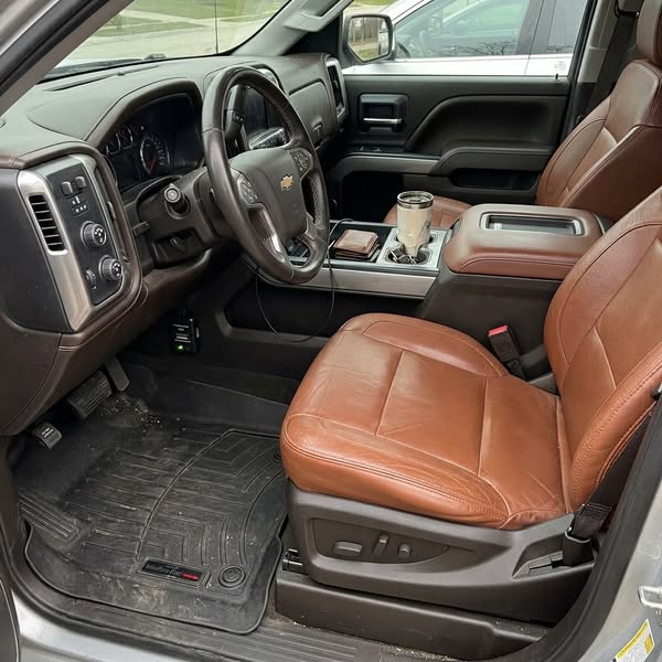 Verified buyer photo — EirCore disabler installed and running in a Silverado High Country interior
