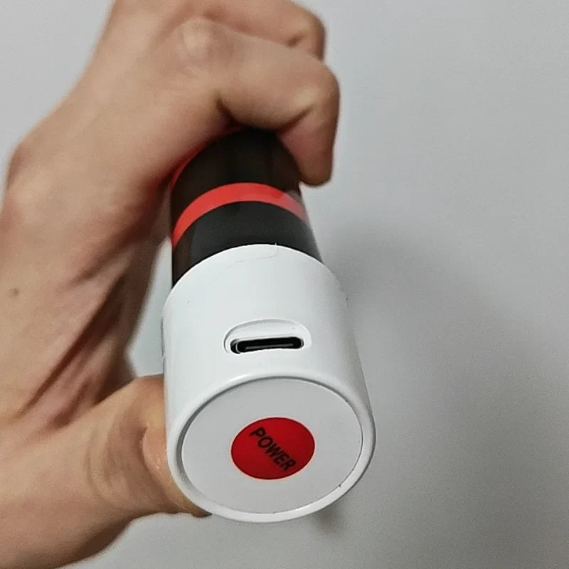 Close-up of the USB-C charging port and power button on the end of the grip