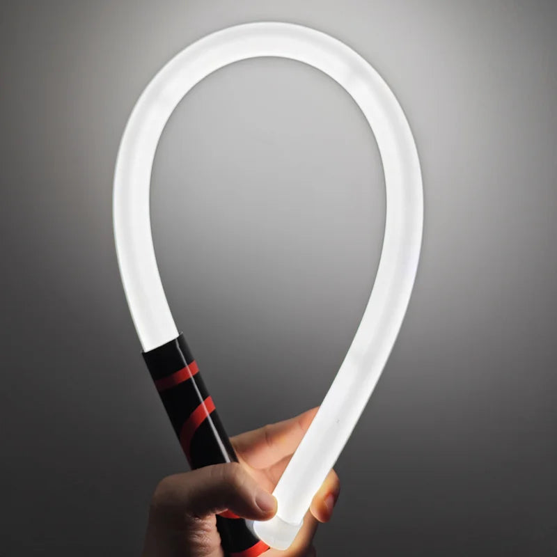 FlexBeam bent into a U shape and lit, held by the grip