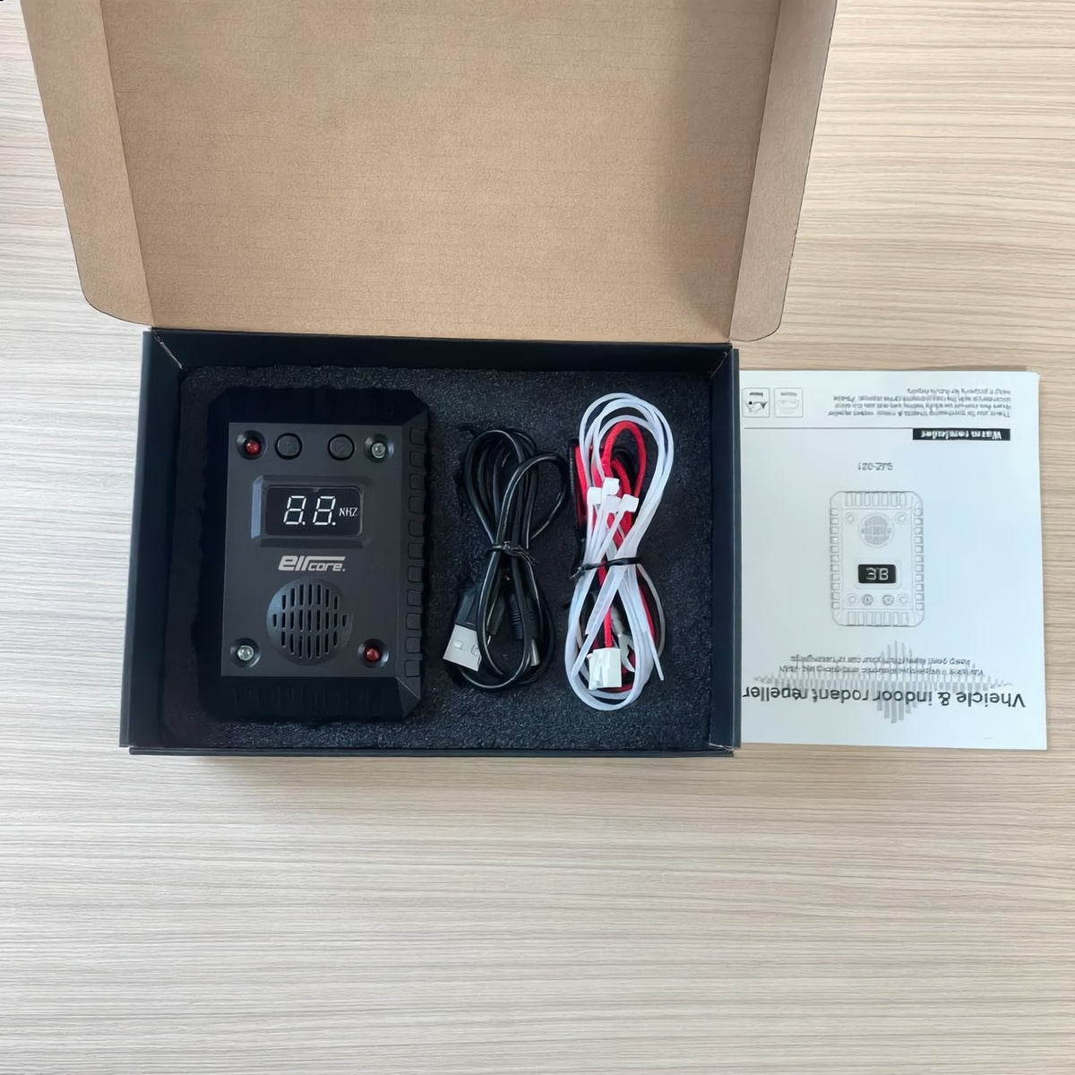 Open EirCore box: RodentPulse unit in a foam insert with its cables, cable ties and user manual